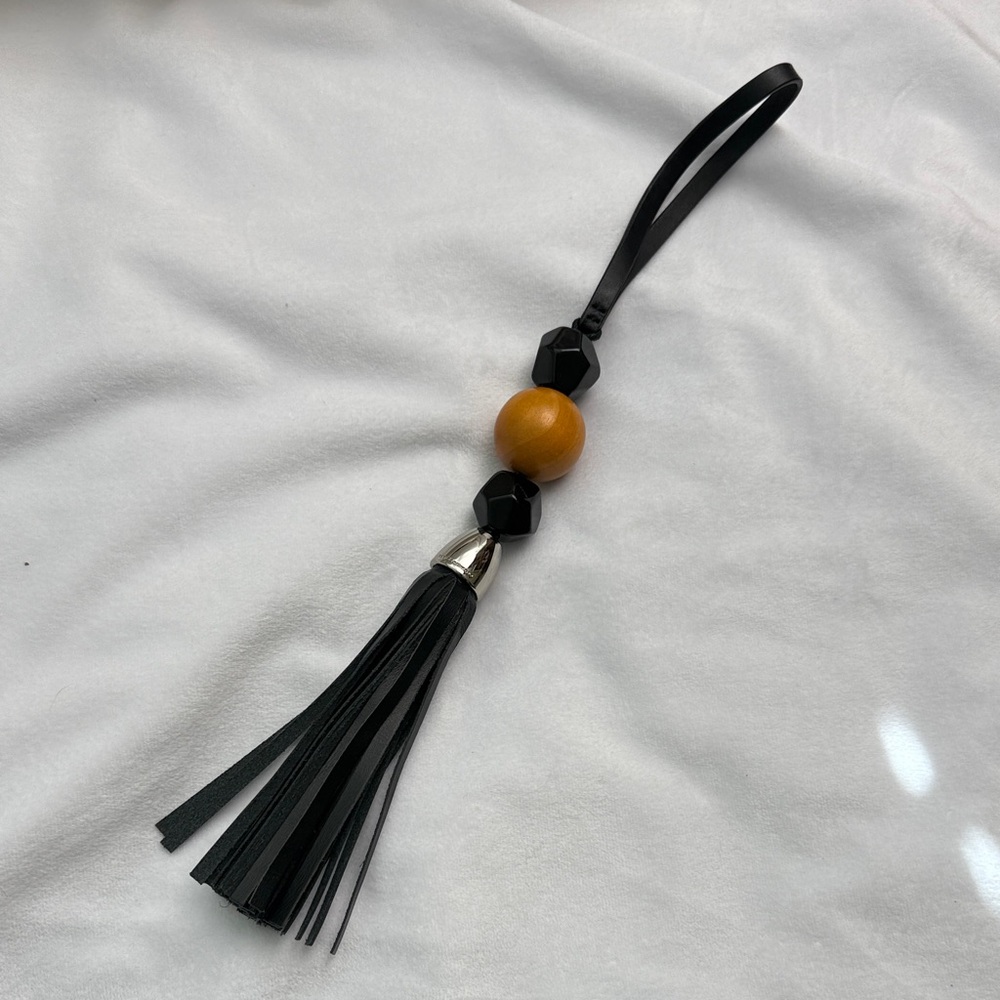 Rebecca Minkoff Black and Wooden genuine leather Tassel bag charm
